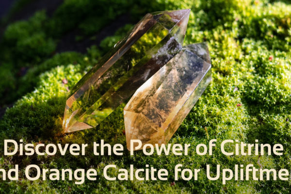 image of two crystals on moss, with text that says 'discover the power of citrine and orange calcite for upliftment'