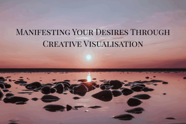 Manifesting Your Desires Through Creative Visualisation text with background of sea shore
